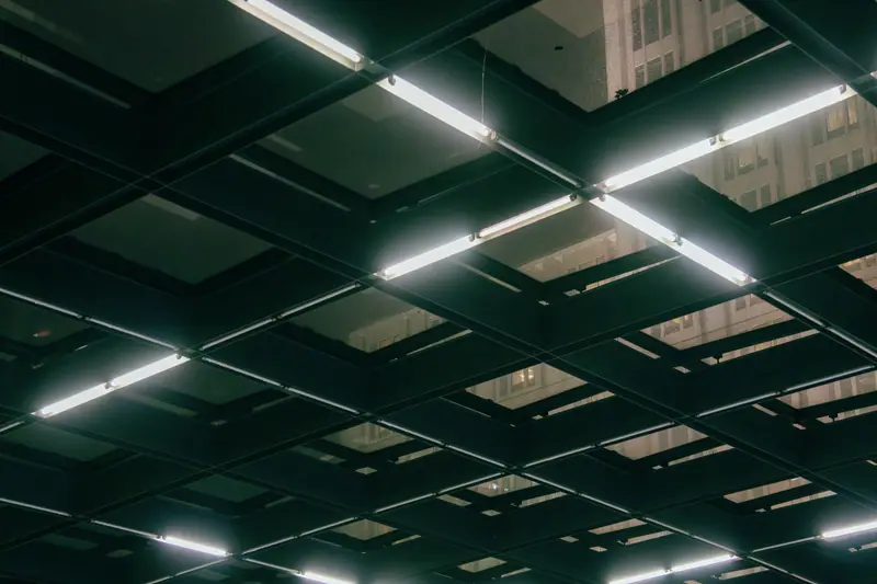 Lights across a dark ceiling grid